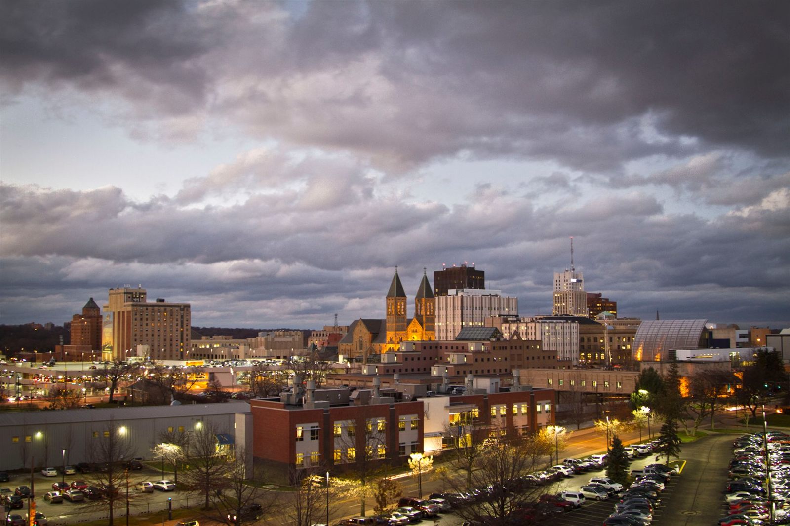 Downtown Akron skyline at dusk with church spires and office towers