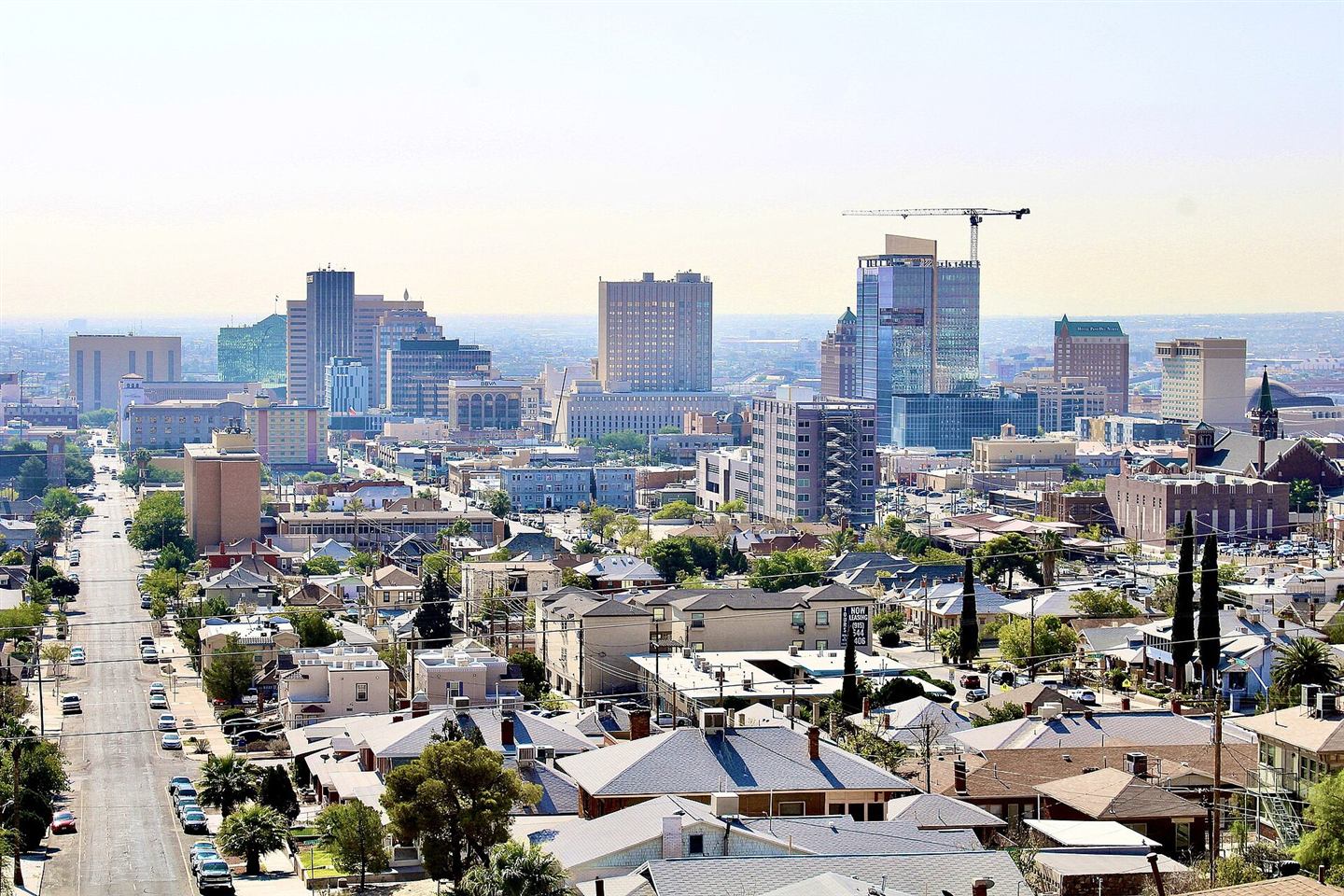 Downtown El Paso, Texas skyline on a sunny day with neighborhoods in the foreground