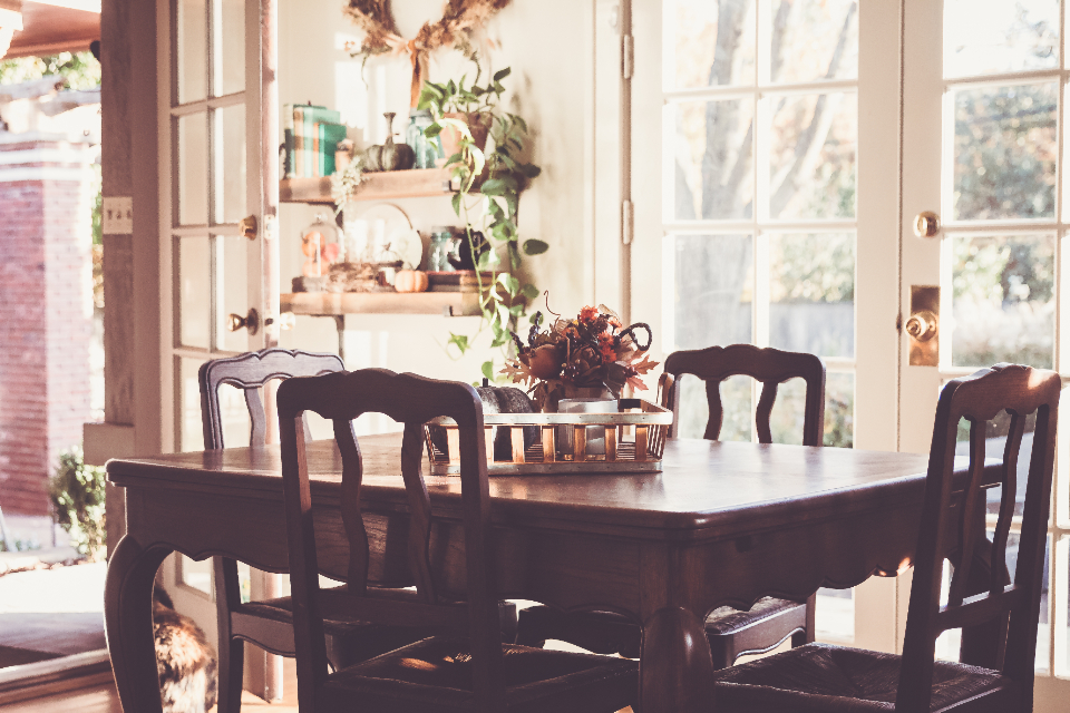 Warm dining room in a longtime family home with wooden table and chairs