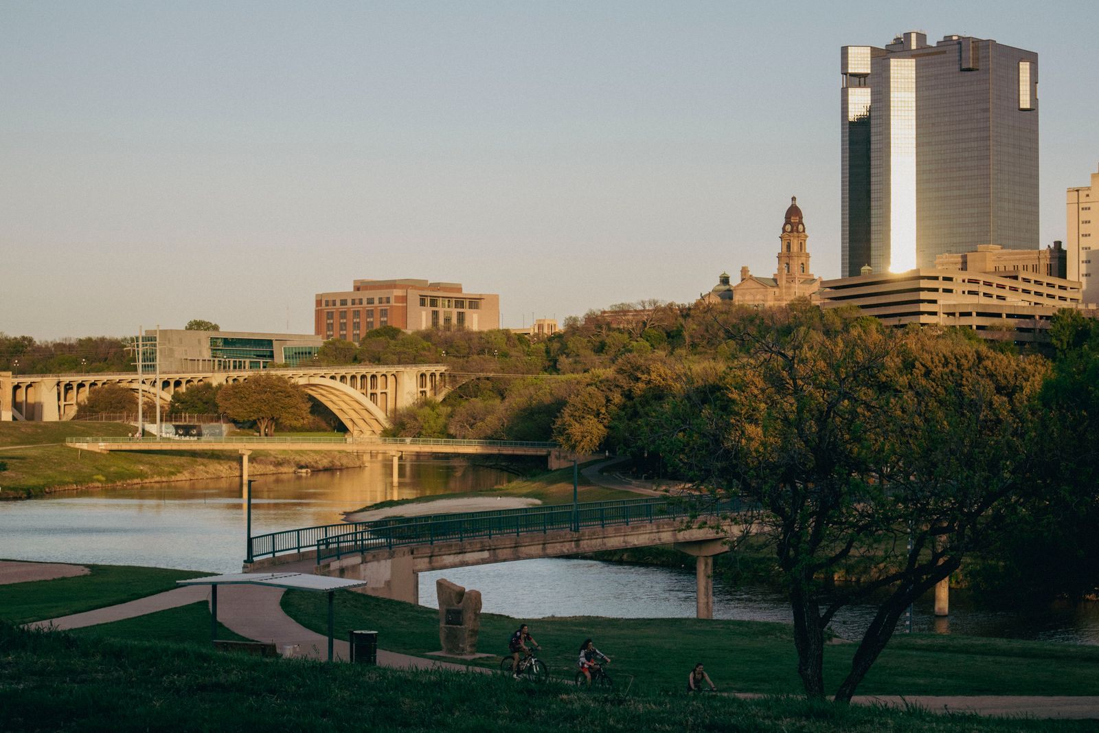 Downtown Fort Worth, Texas skyline with the Tarrant County Courthouse rising above the Trinity River at sunset