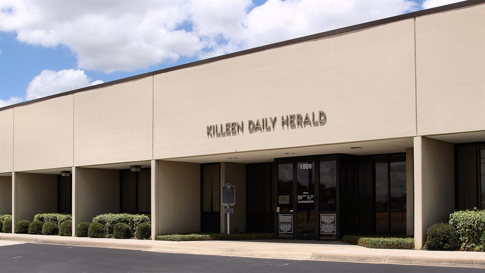 The Killeen Daily Herald building in Killeen, Texas under a blue sky