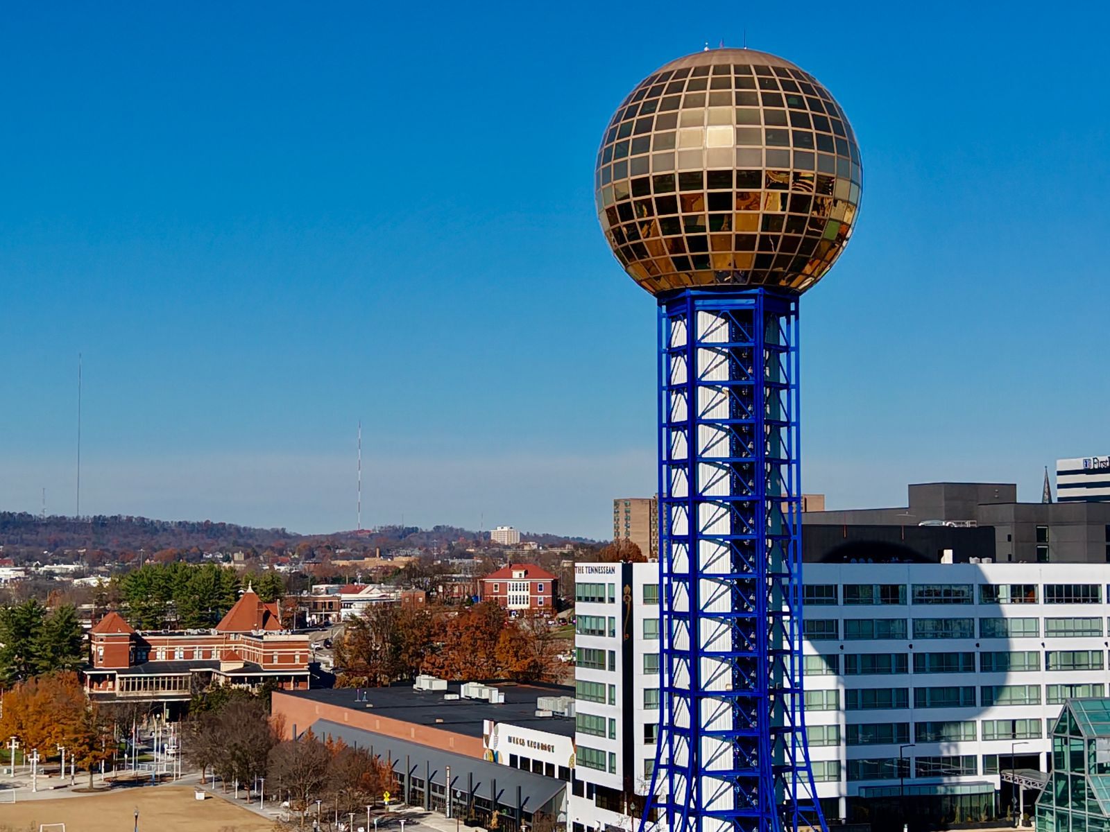 The golden Sunsphere tower above downtown Knoxville, Tennessee on a clear day