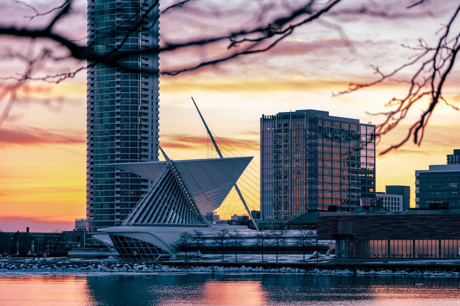 Milwaukee Art Museum and lakefront towers at sunset
