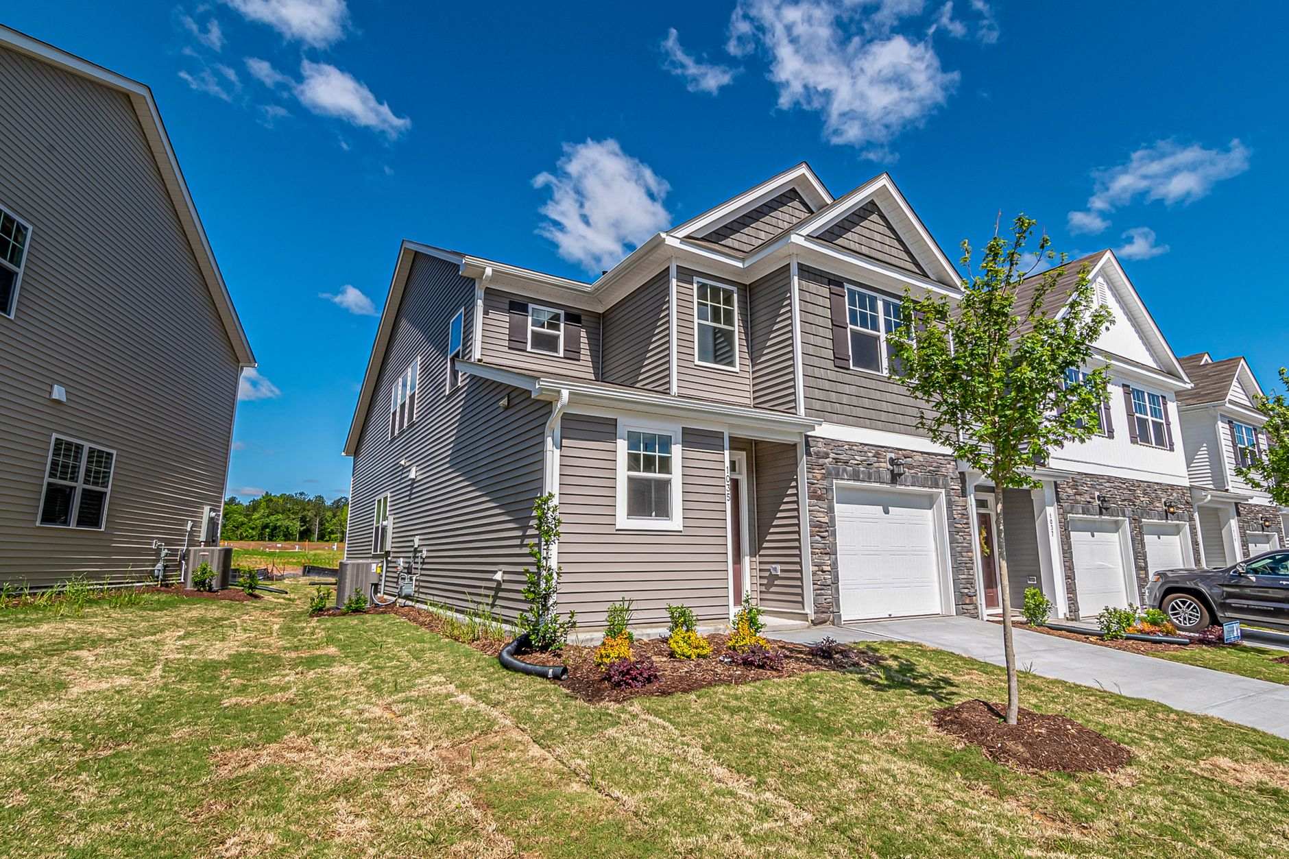 Row of newly built townhomes, the kind of construction reshaping Charlotte's neighborhoods