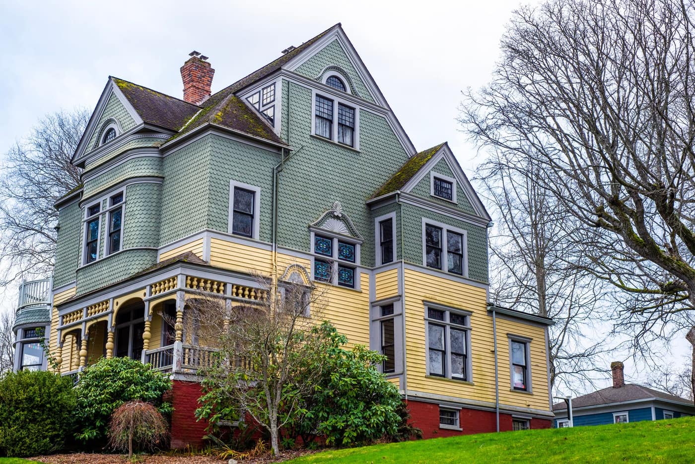 Aging Victorian-era house with weathered brick and trim, typical of St. Louis's century-old housing stock